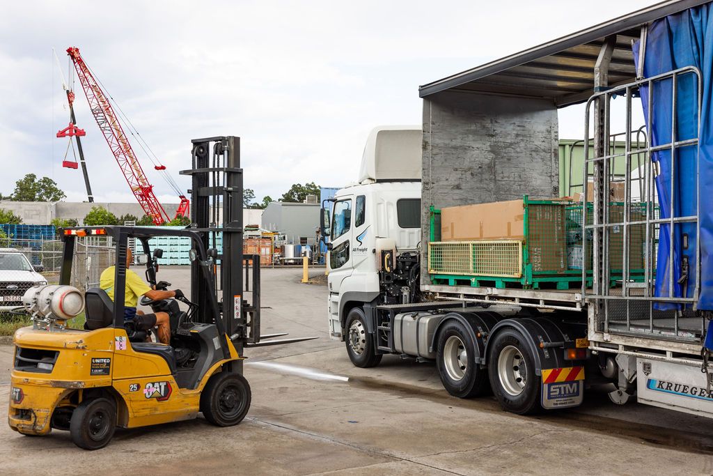 Forklift loading a semi-trailer for linehaul